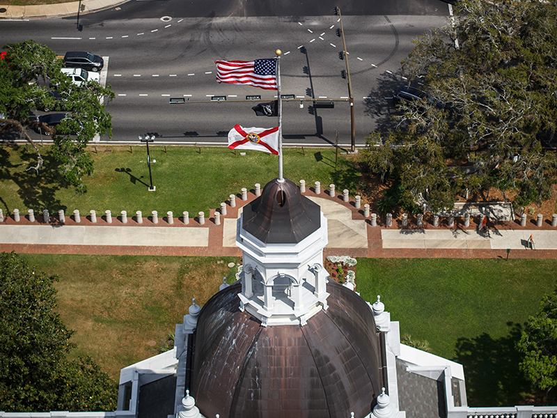 The historic Florida State Capitol dome shines in the daylight.