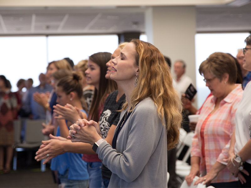 People praying and worshipping together.